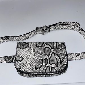 White , black , grey fannypack w/ buckle.  Never worn.